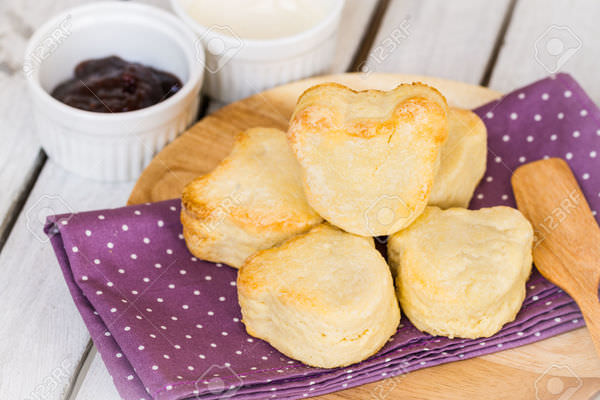 27887904-bear-shape-scone-with-butter-and-raspberry-jam-Stock-Photo.jpg