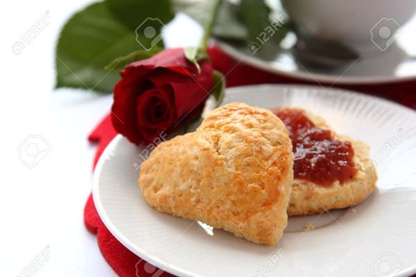 17410928-Heart-shaped-scones-with-strawberry-jam-and-a-cup-of-tea-Stock-Photo.jpg
